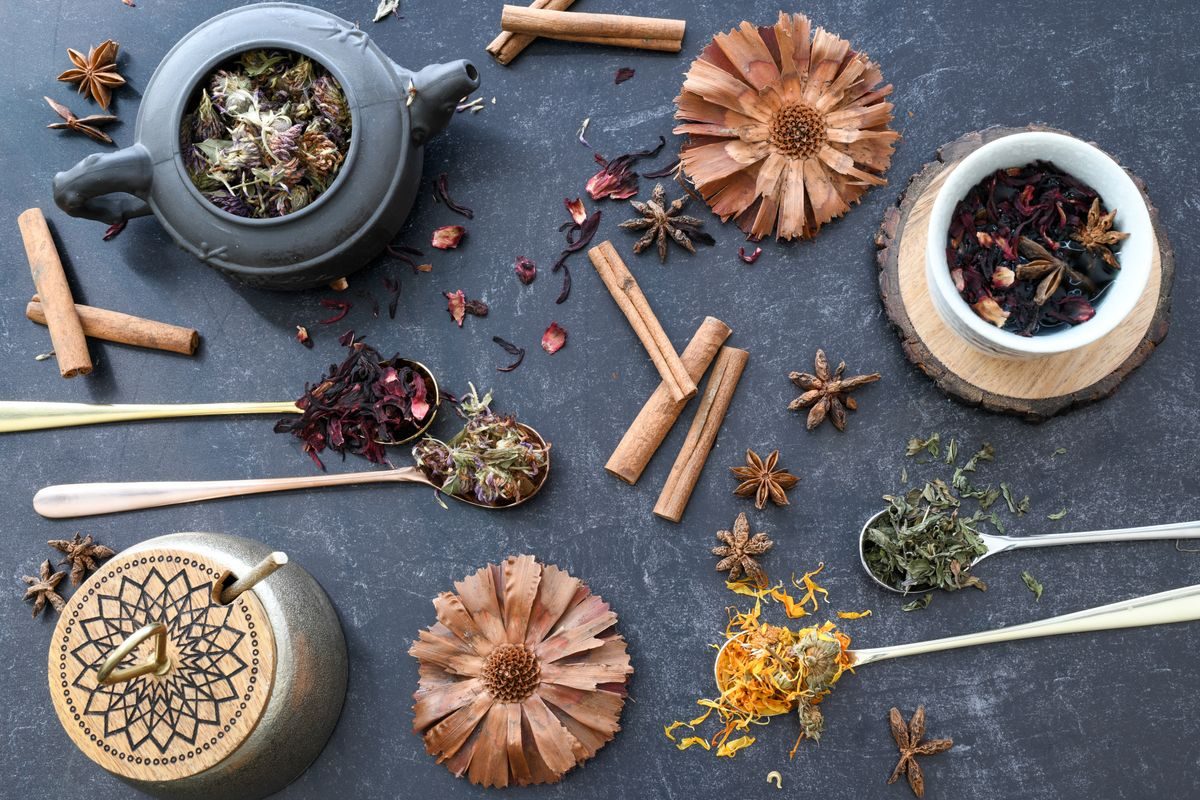 Ayurvedic herbs, spices and herbal tea ingredients in small bowls